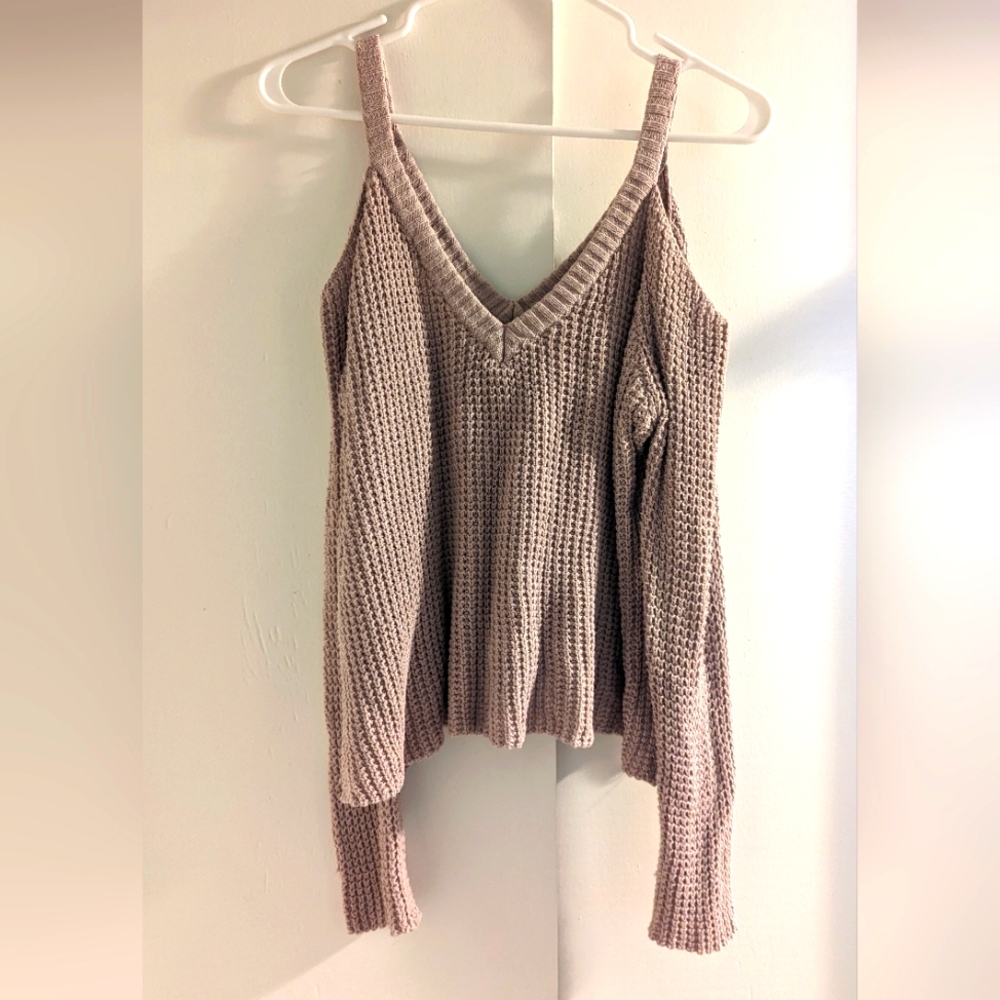 Knit sweater with shoulder cut outs